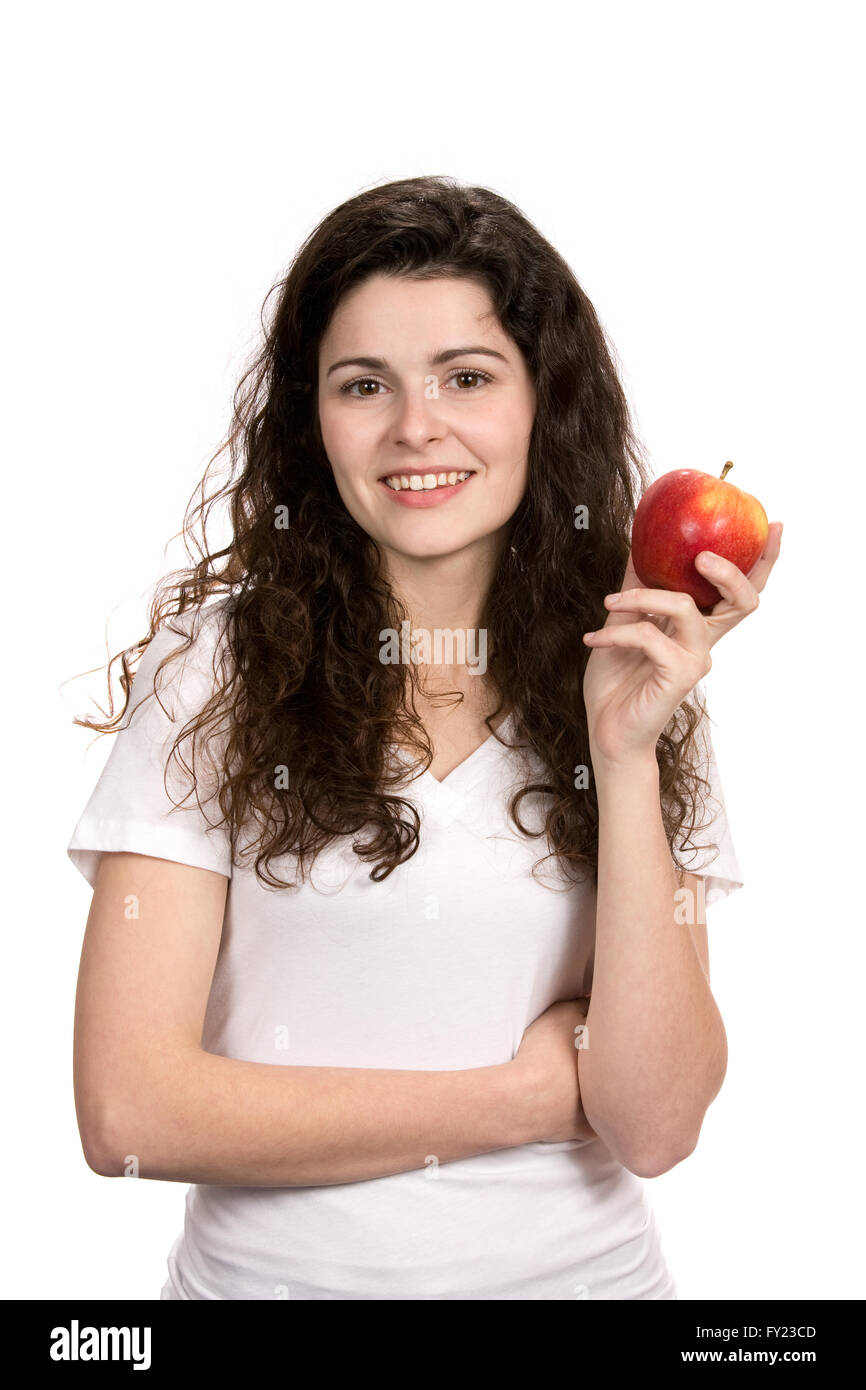 Lächelnde junge Frau hält einen Apfel für einen gesunden Lebensstil-Konzept. Stockfoto