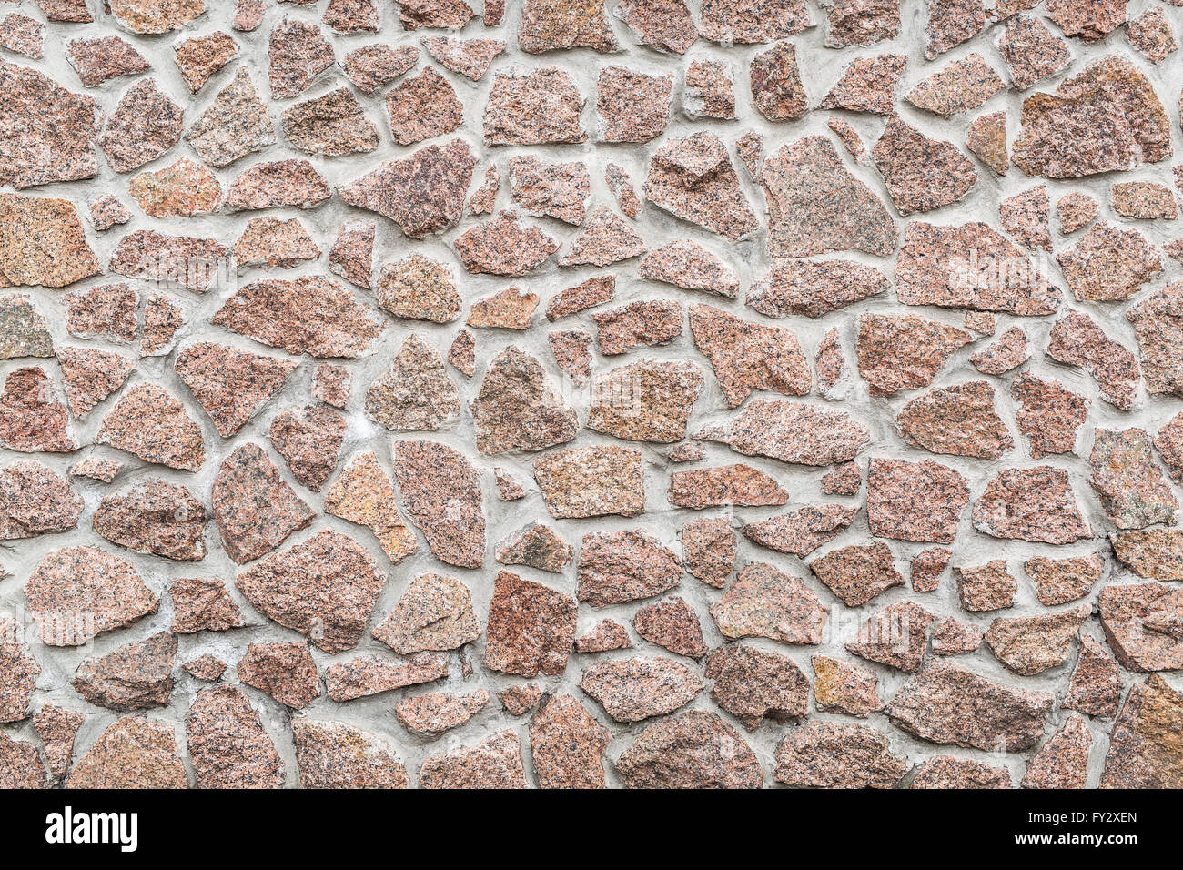 Steinmauer (Zaun). Nahaufnahme Bild von Ziegeln. Stockfoto