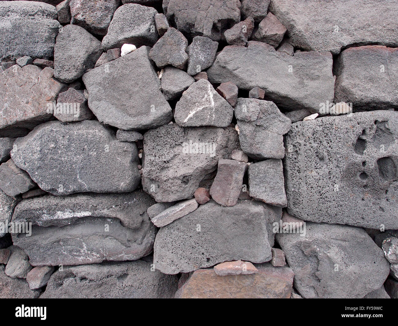 Nahaufnahme einer alten Steinmauer der Lava auf der Big Island Hawaii. Stockfoto