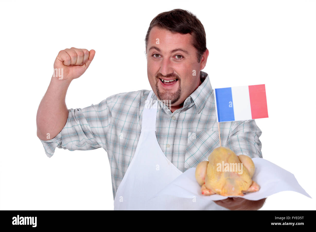 Mann in eine weiße Schürze feiern französische Geflügel Stockfoto