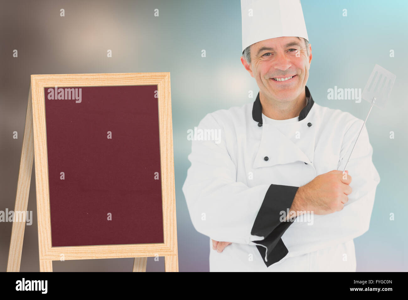 Zusammengesetztes Bild eines Kochs halten utensil Stockfoto