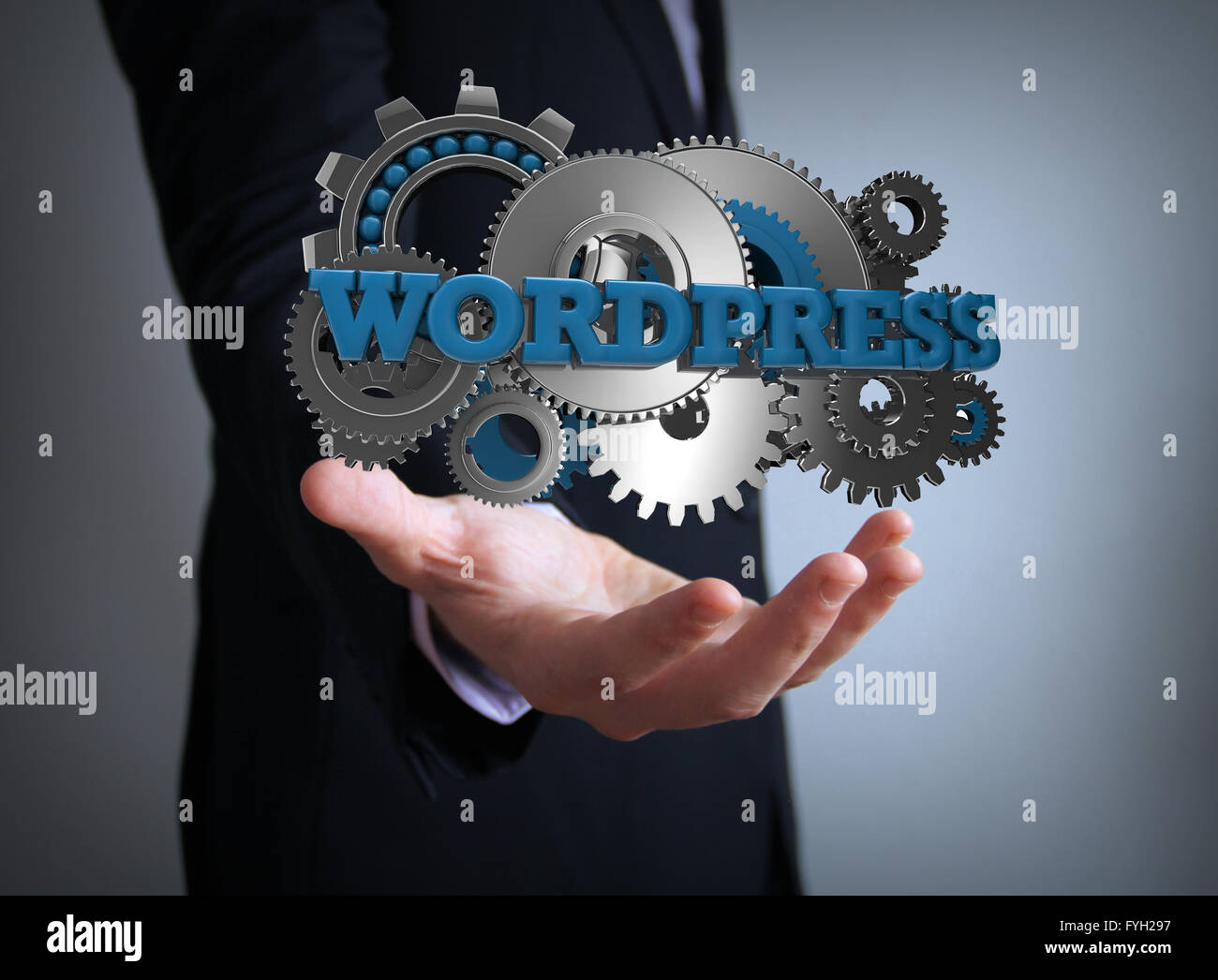 Programmierkonzept: Text Wordpress mit Zahnrädern über Geschäftsmann Hand Stockfoto