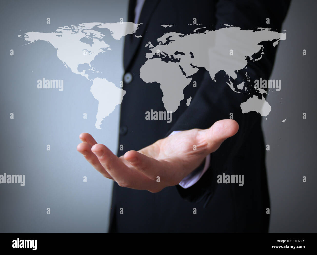 Weltkarte über Geschäftsmann hand Stockfoto