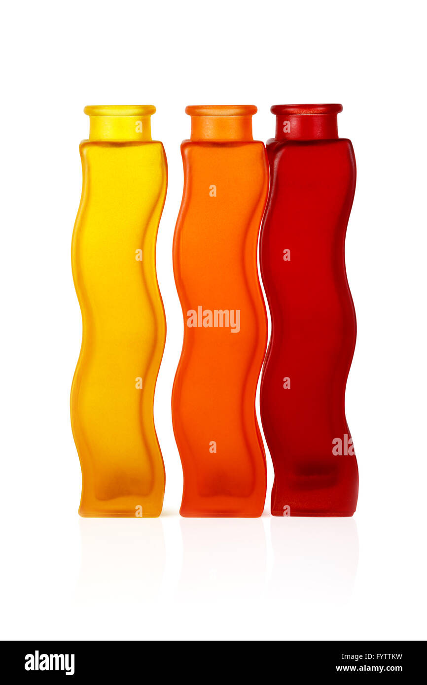 Drei Flaschen aus farbigem Glas Stockfoto