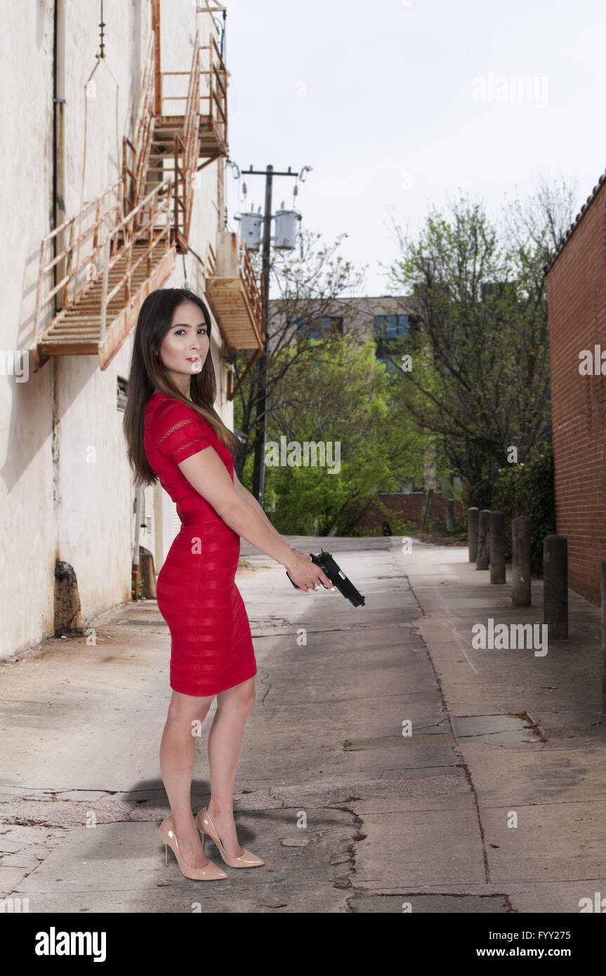 Frau mit Pistole Stockfoto