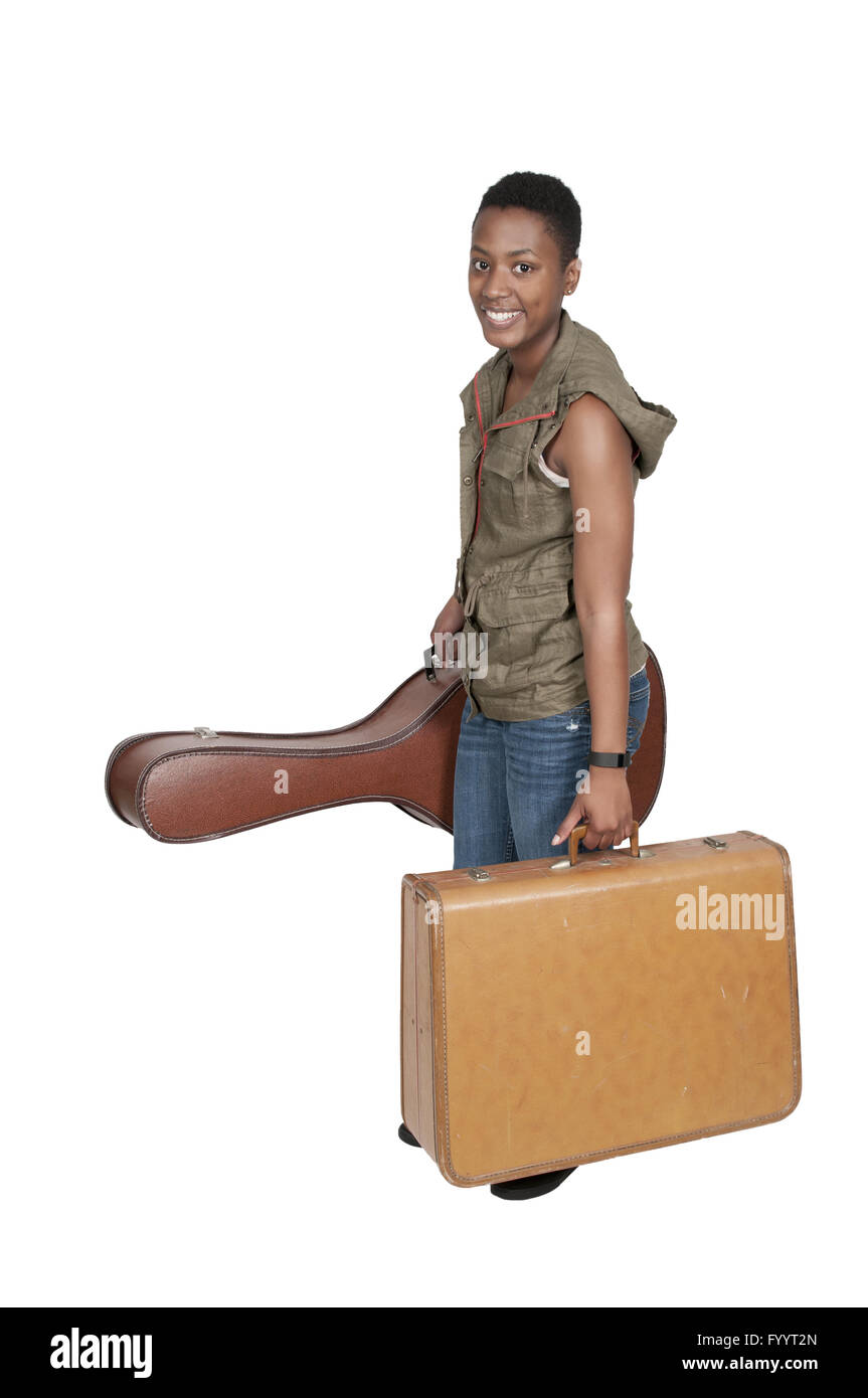 Frau mit Gitarre und Koffer Stockfoto