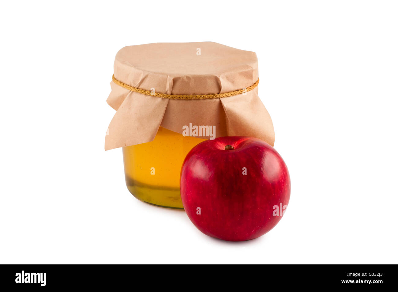 Honig, Glas, Holzlöffel, roter Apfel, isoliert. Stockfoto