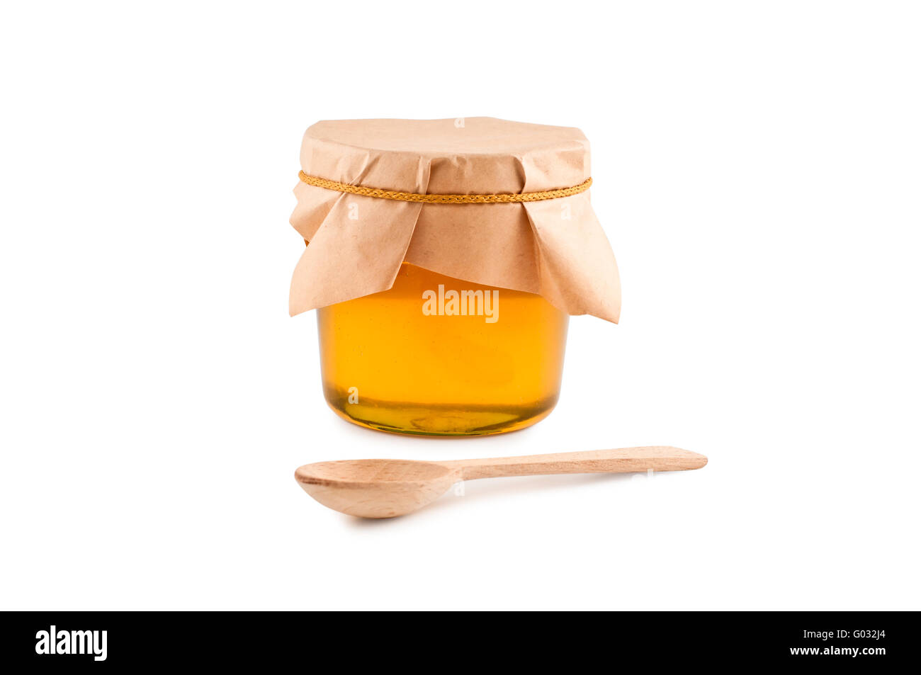 Honig im Glas, Löffel, isolierten weißen Hintergrund. Stockfoto
