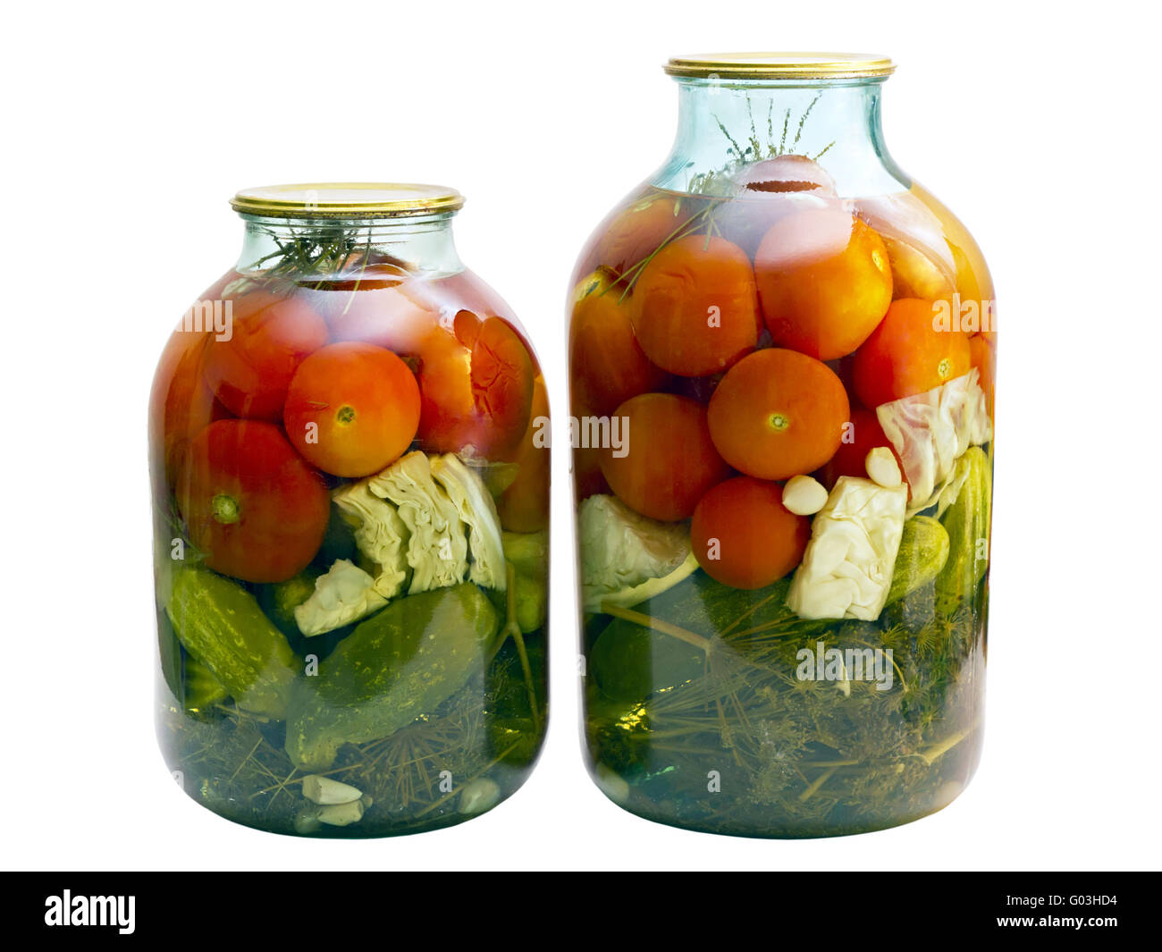 Tomaten aus der Dose und Gurken im Weckglas Stockfoto