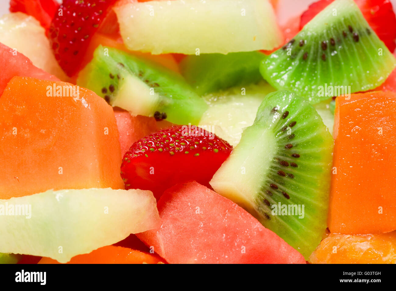 Frischer Obstsalat-Hintergrund Stockfoto