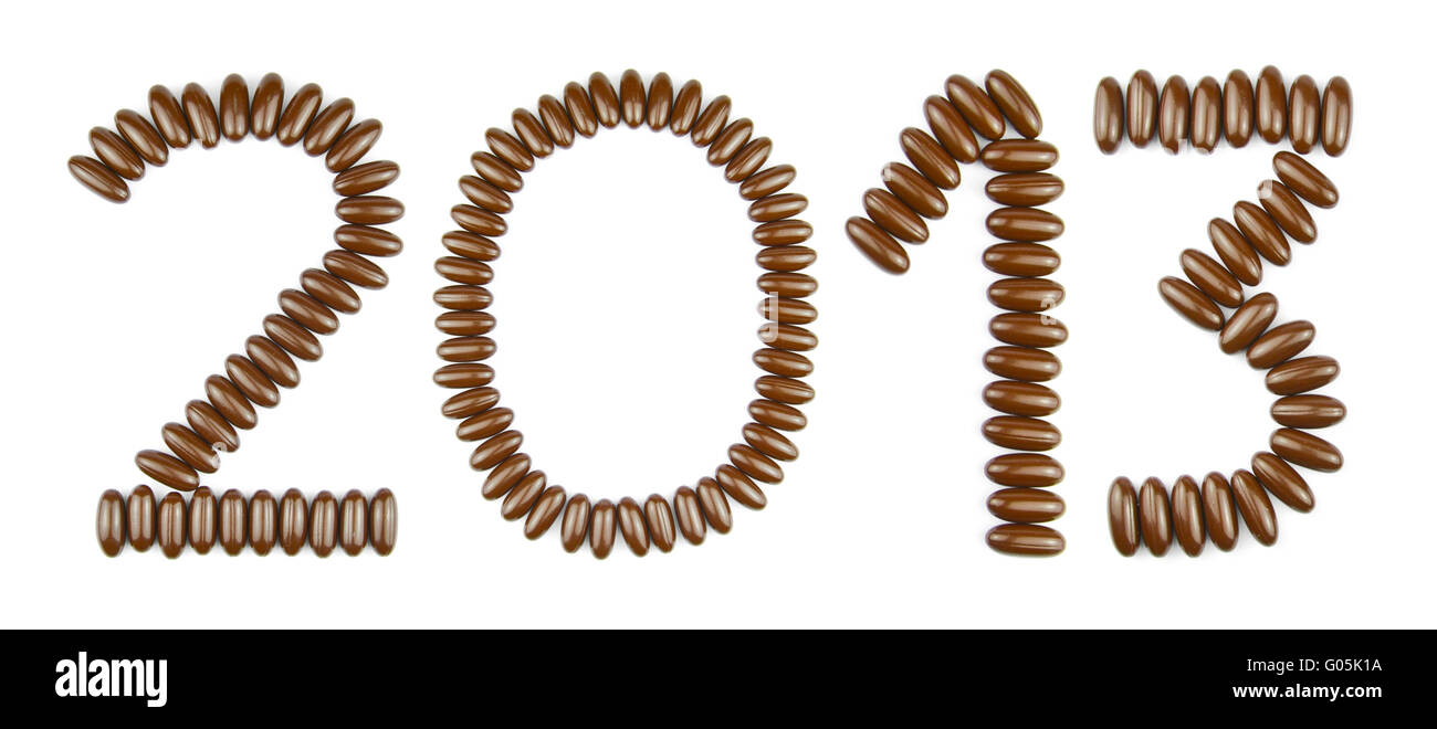 Frohes neues Jahr 2013 mit Pralinen (isoliert auf weißem Hintergrund) Stockfoto