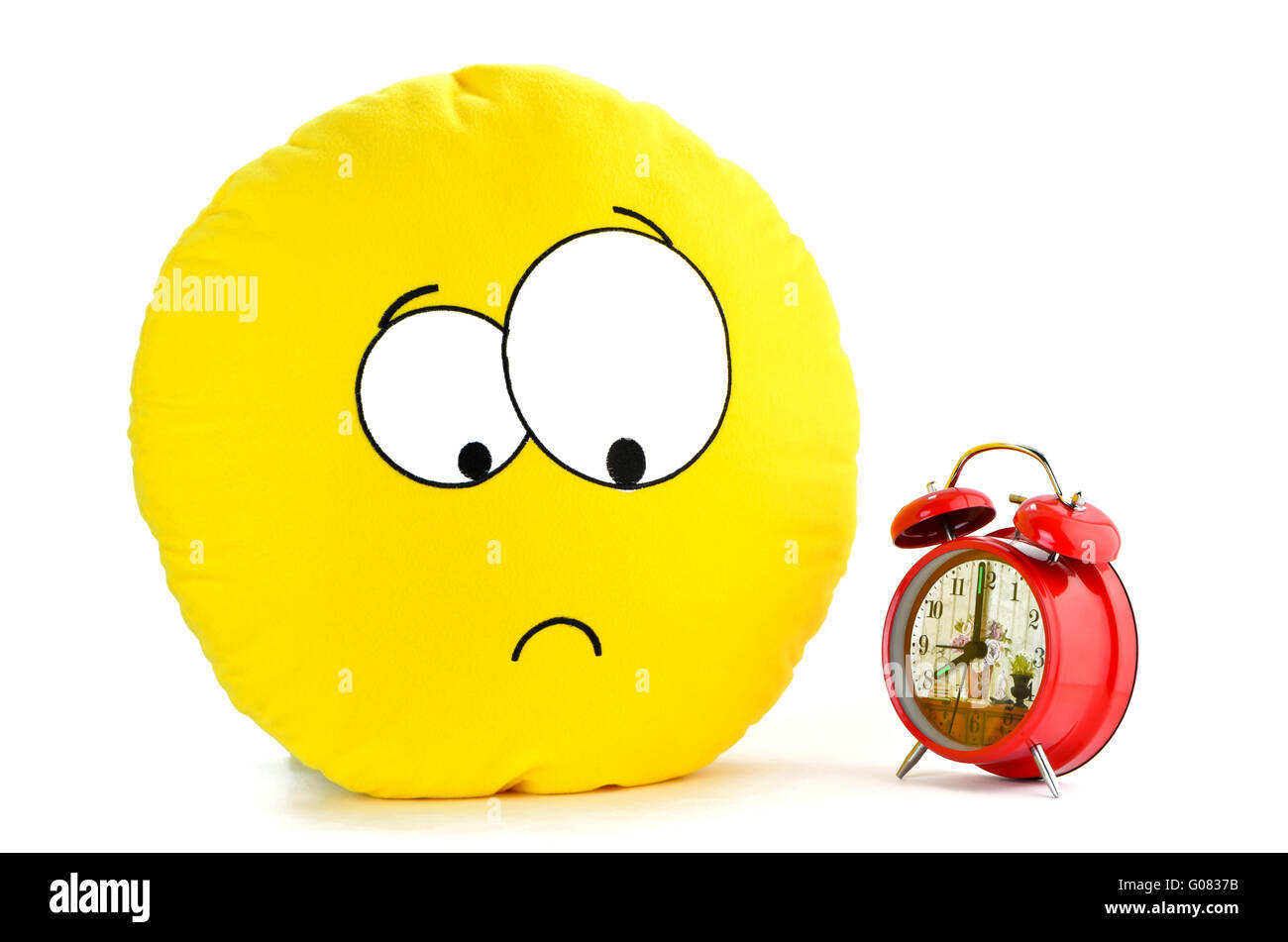 Lächeln und einem roten Wecker Stockfoto