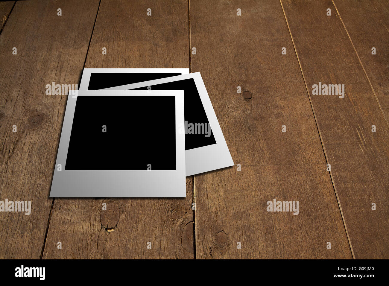 Polaroid auf dem Holzboden Stockfoto