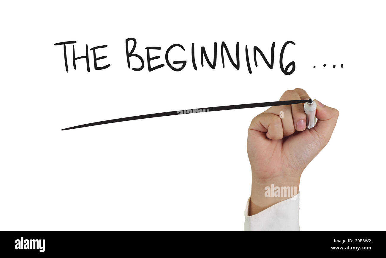 Motivationalen Konzept Bild von einer Hand mit Marker und Write The Beginning Wörter isoliert auf weiss Stockfoto