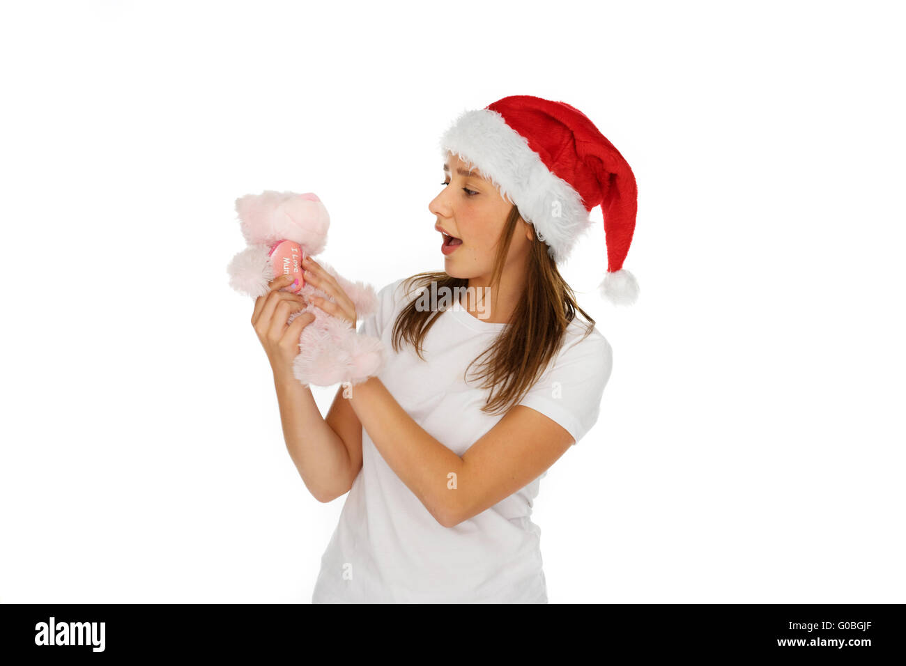 Junges Mädchen in rote Weihnachtsmütze Stockfoto