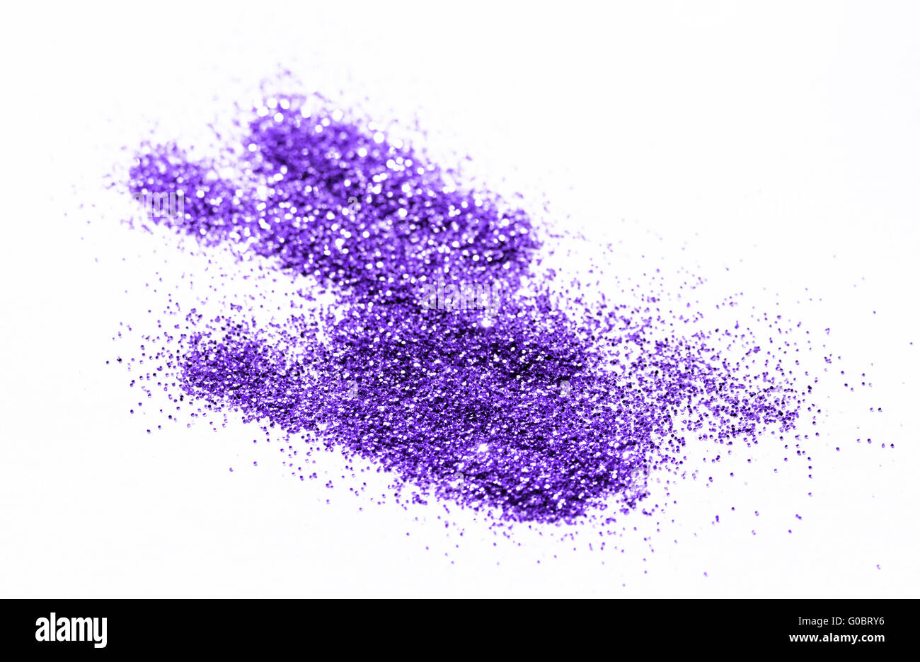 Lila Glitzer auf hellem Hintergrund - Makrofoto Stockfoto
