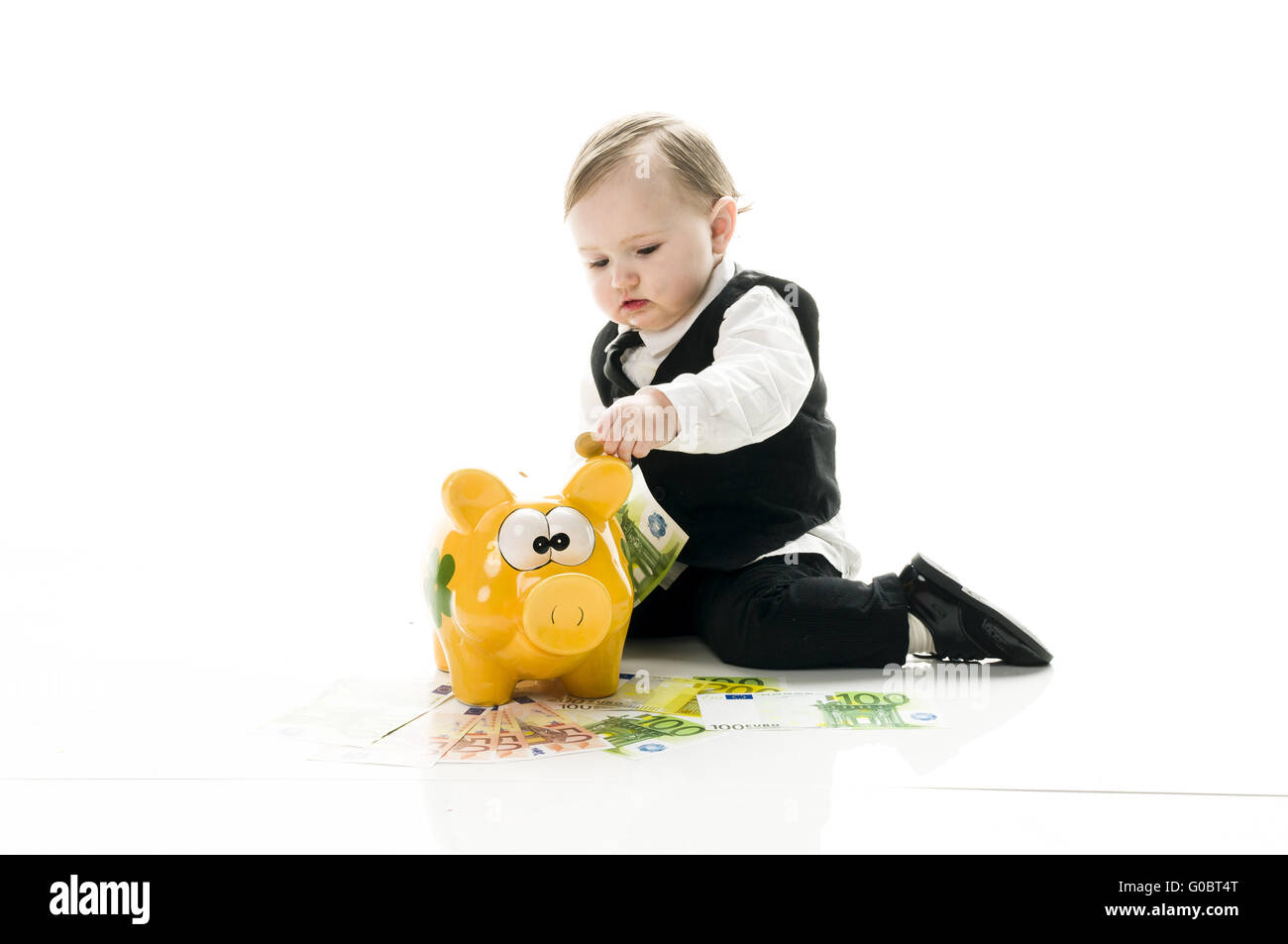 Geschäft Baby mit Sparschwein Stockfoto