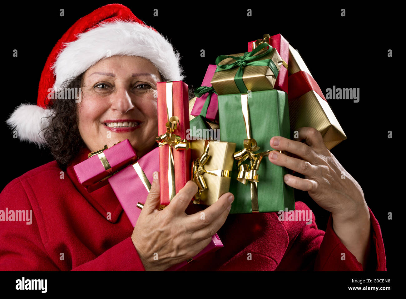 Glücklich weibliche Senior heben viele verpackt Geschenke Stockfoto