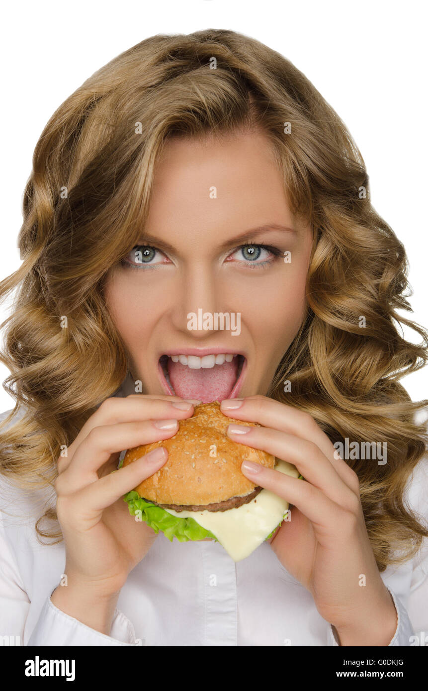 Schöne junge Frau, die Bissen des hamburger Stockfoto
