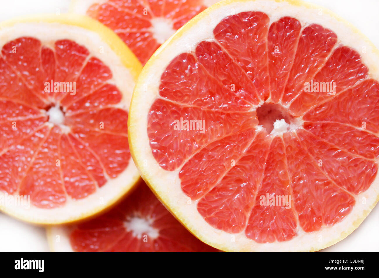 Schneiden Sie Stücke der Früchte der rote grapefruit Stockfoto