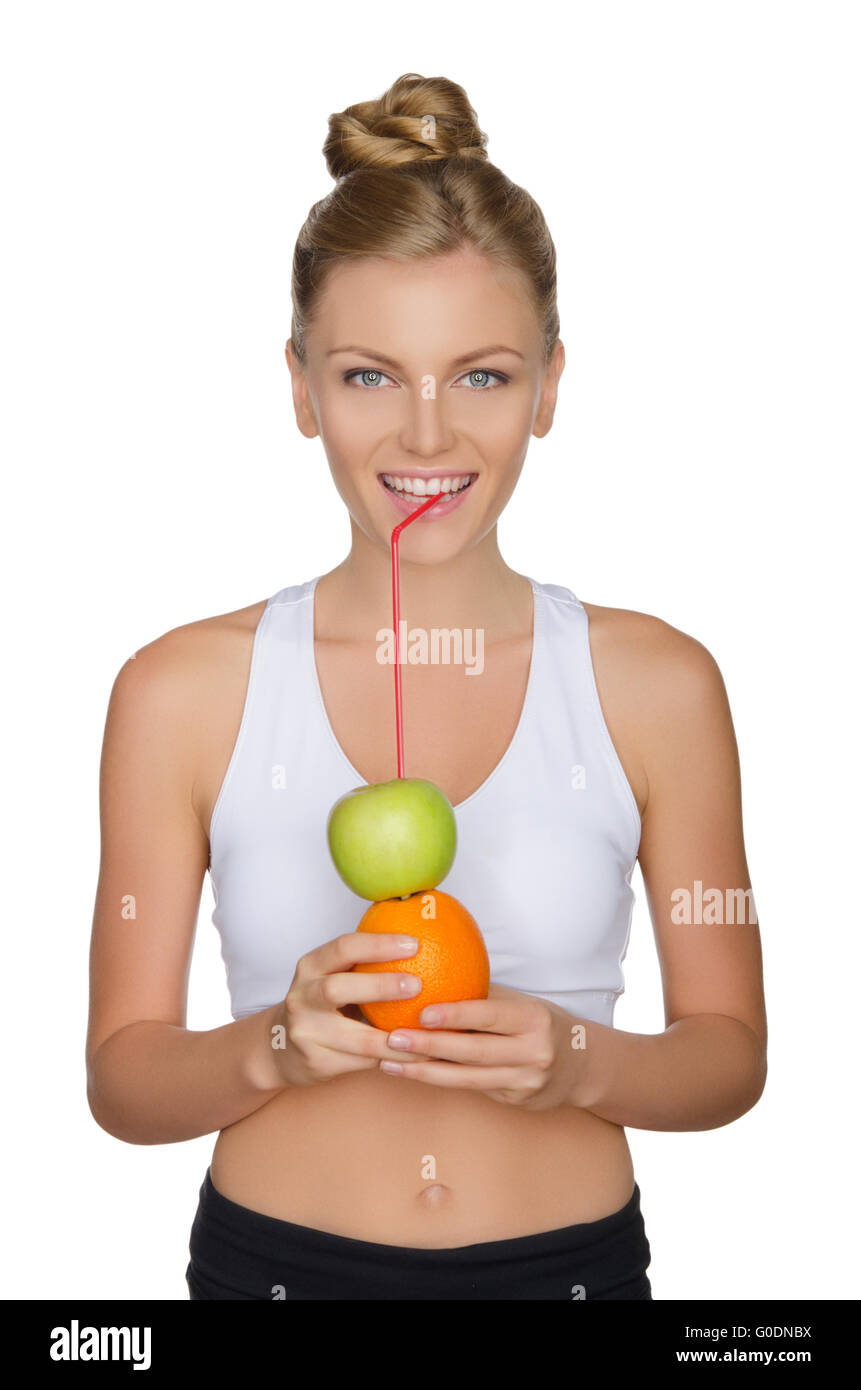 attraktive Frau trinken Saft aus Apfel, orange Stockfoto