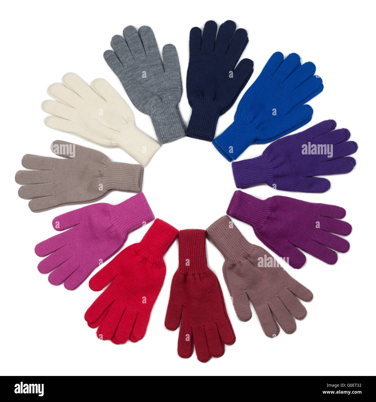 Gestrickte Handschuhe, verschiedene Farben auf weißem Hintergrund isoliert Stockfoto