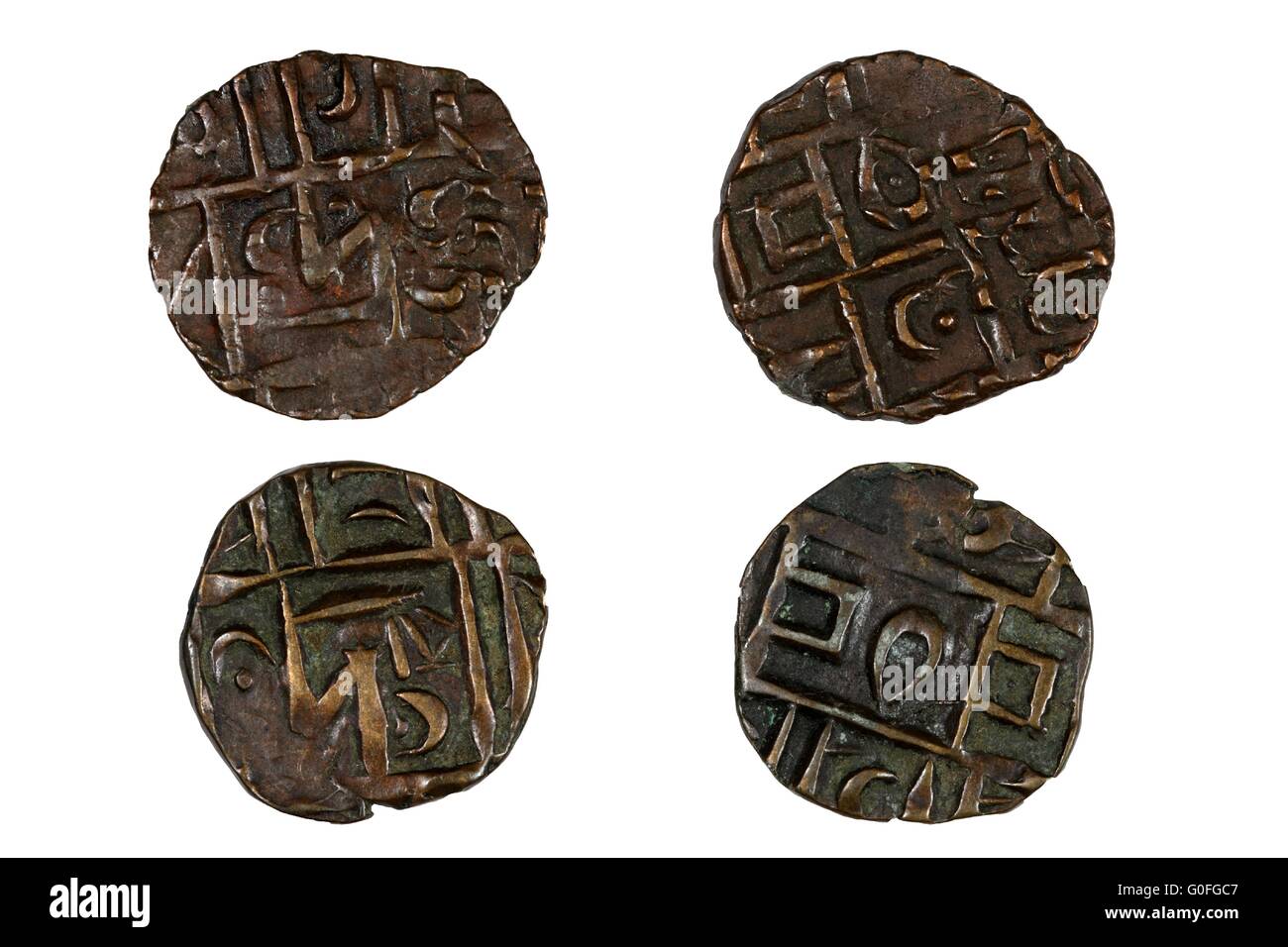 Antike Münzen aus dem Königreich Bhutan in Asien. Stockfoto