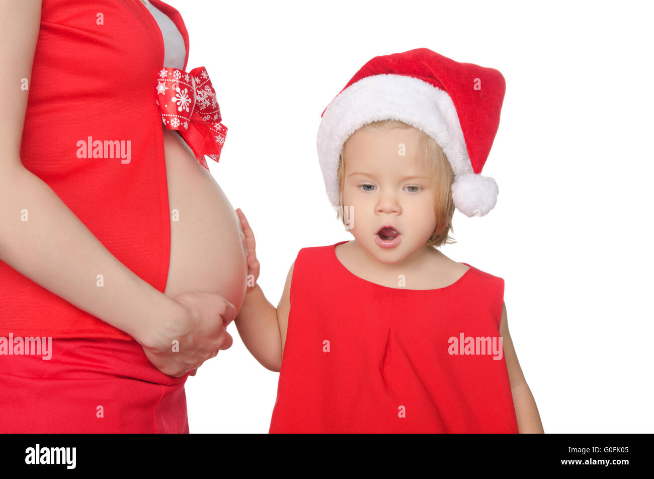 überrascht, Kinder- und Schwangeren in Weihnachten Kleidung Stockfoto