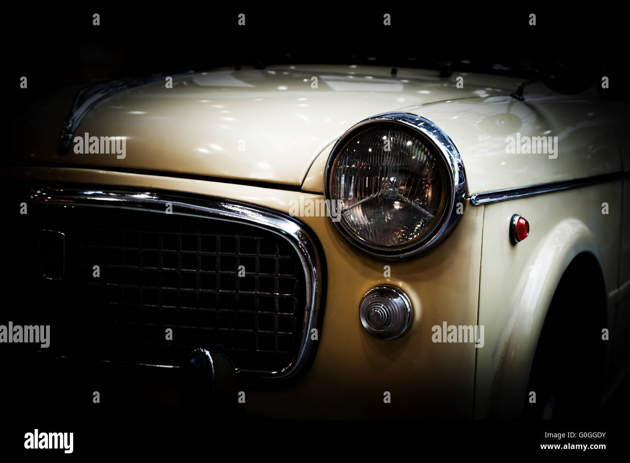 Retro classic car on black background. Vintage, elegant Stockfoto