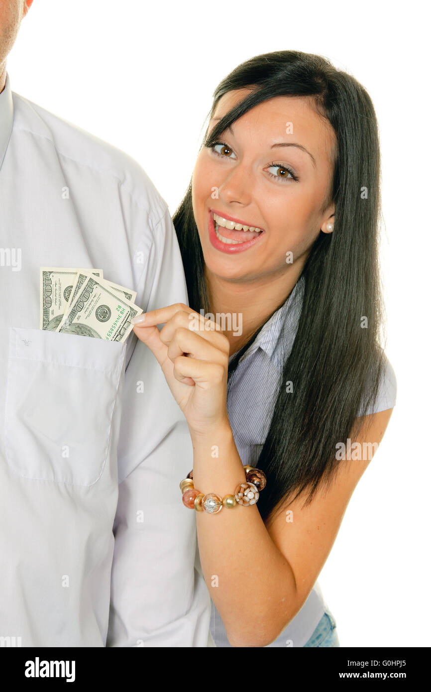 Frau zieht einen Mann aus dem Geld Tasche.Dollar Stockfoto
