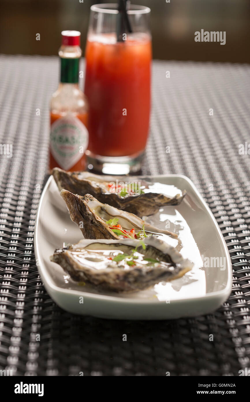 Maldon Austern mit Chili, Ingwer & Reis Weinessig Stockfoto