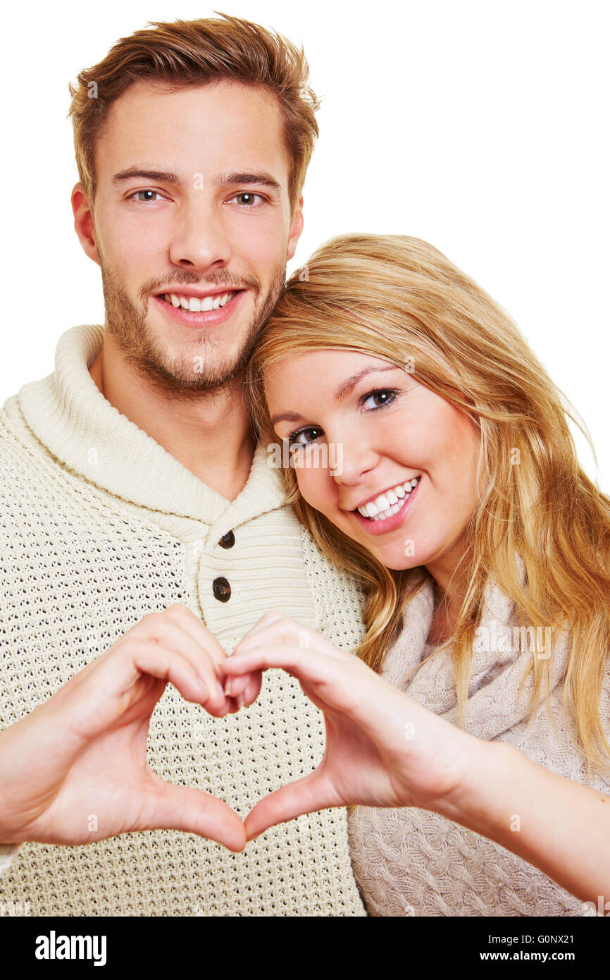Mann und Frau in der Liebe bilden Herz mit ihren Händen Stockfoto