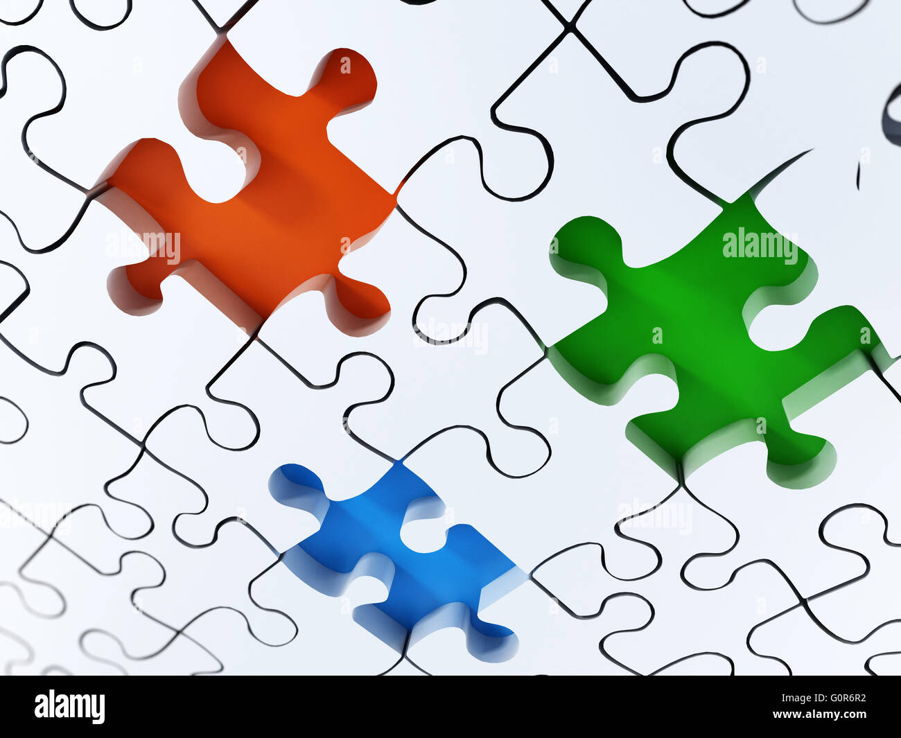 Jigsaw Puzzle-Hintergrund mit grünen, gelben und roten Löchern. Stockfoto
