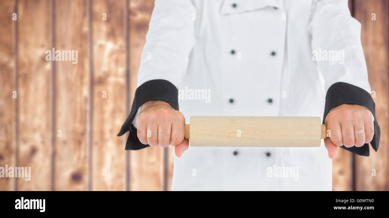 Zusammengesetztes Bild von Close Up auf einem Koch mit einem Nudelholz Stockfoto