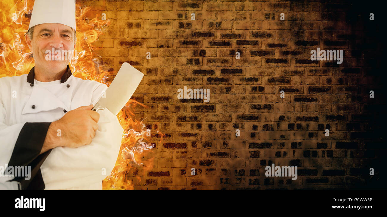 Zusammengesetztes Bild der freundliche Chef verschränkte Arme Stockfoto