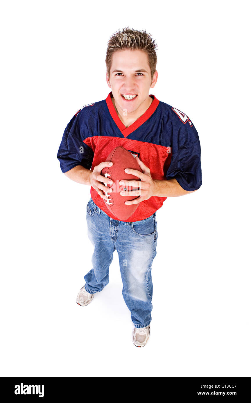 Serie mit einem Fußball-Fan, isoliert auf weiß und in einem Zimmer vor dem Fernseher. Stockfoto