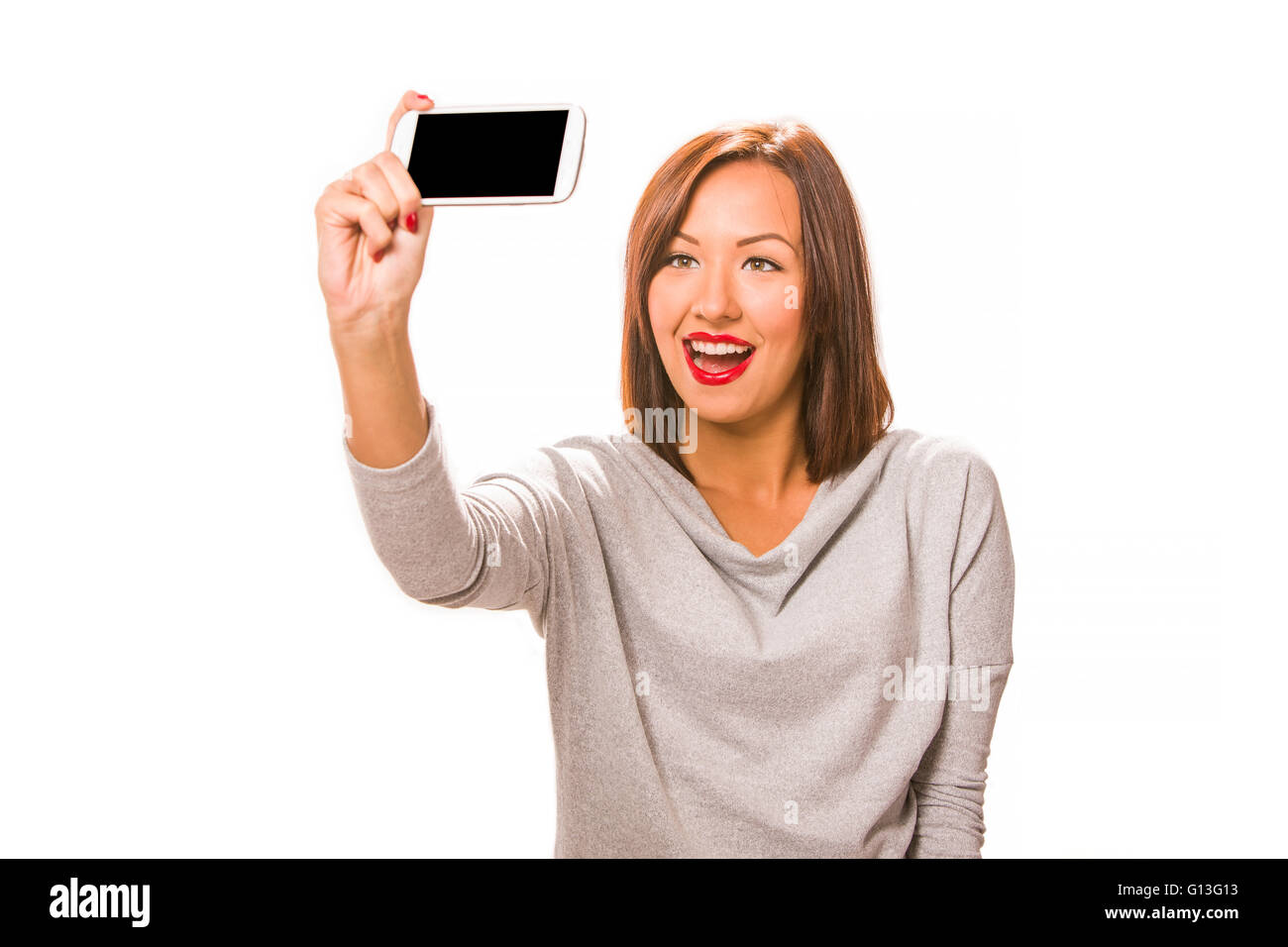 Schöne glückliche junge Frau nehmen Selfie mit Smartphone. Stockfoto
