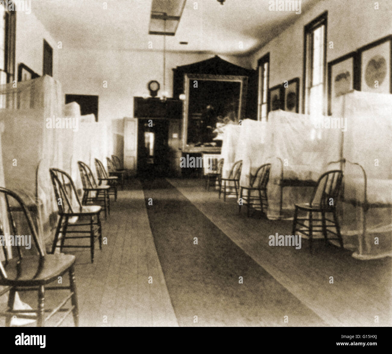 Erste-Hilfe-Krankenhaus Exponat auf der 1876 Centennial Exposition in Philadelphia.  Die 1875 Thomas Eakins Malerei, "Die Brutto-Klinik" im Hintergrund gesehen werden. Stockfoto