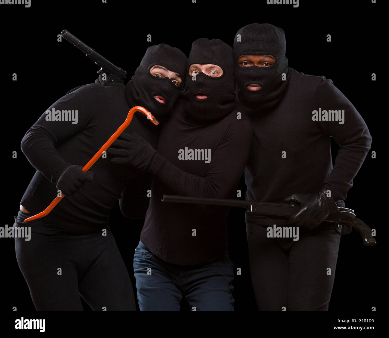 Diebe in Masken Stockfoto