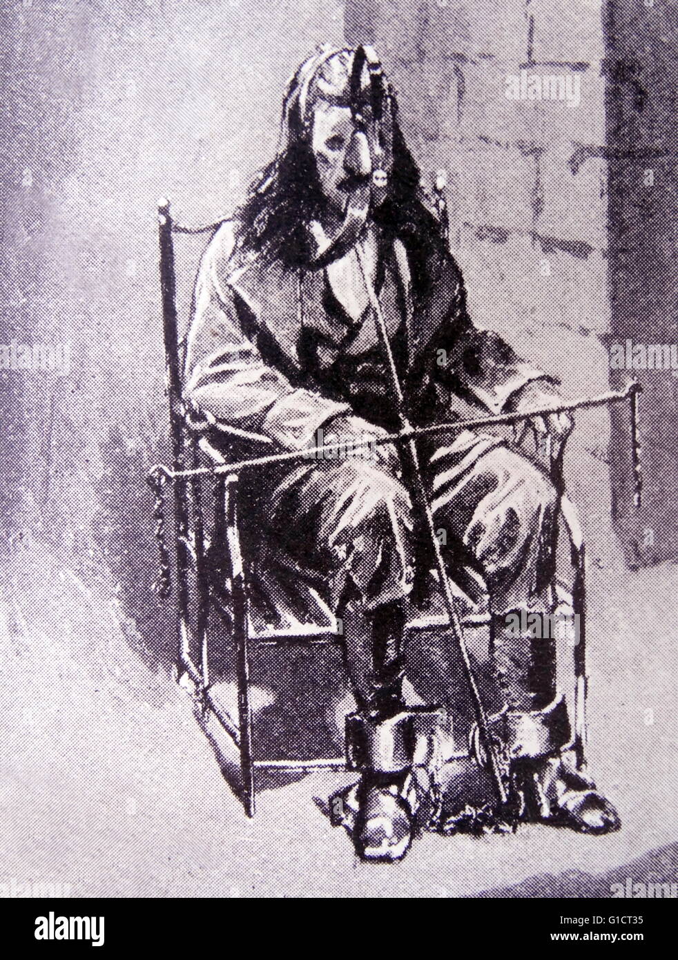 18. Jahrhundert Folter eines Gefangenen in eine metallene Maske und Ketten Stockfoto