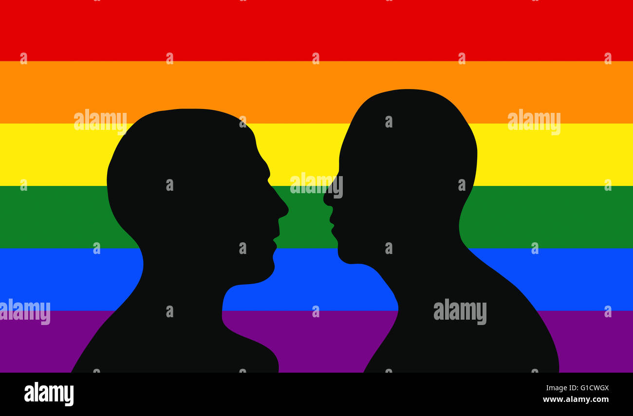 Ein schwules Paar vor der Regenbogen Flagge. Stockfoto
