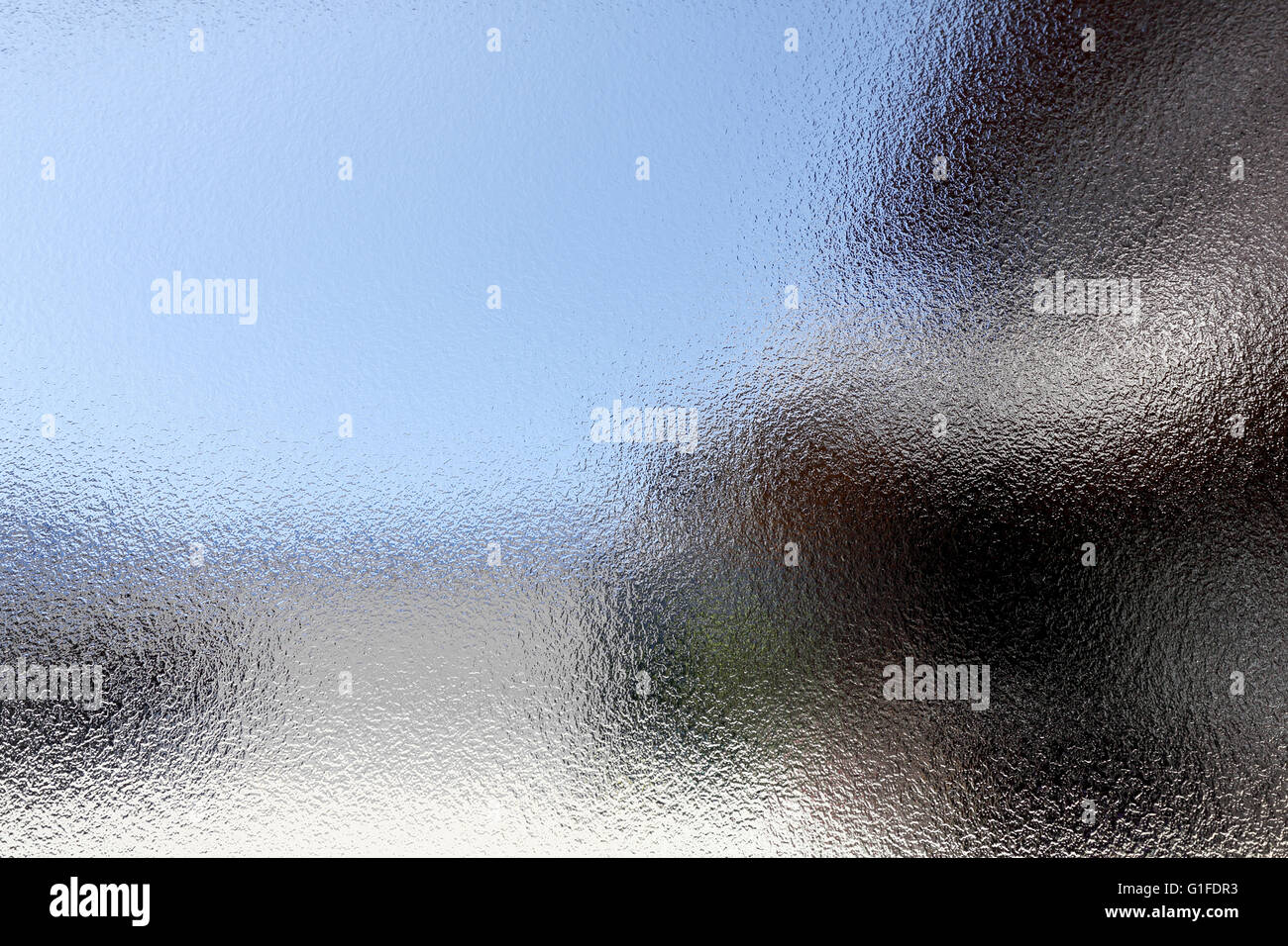Glasmalerei-Hintergrund mit dunklen und hellen Teilen Stockfoto