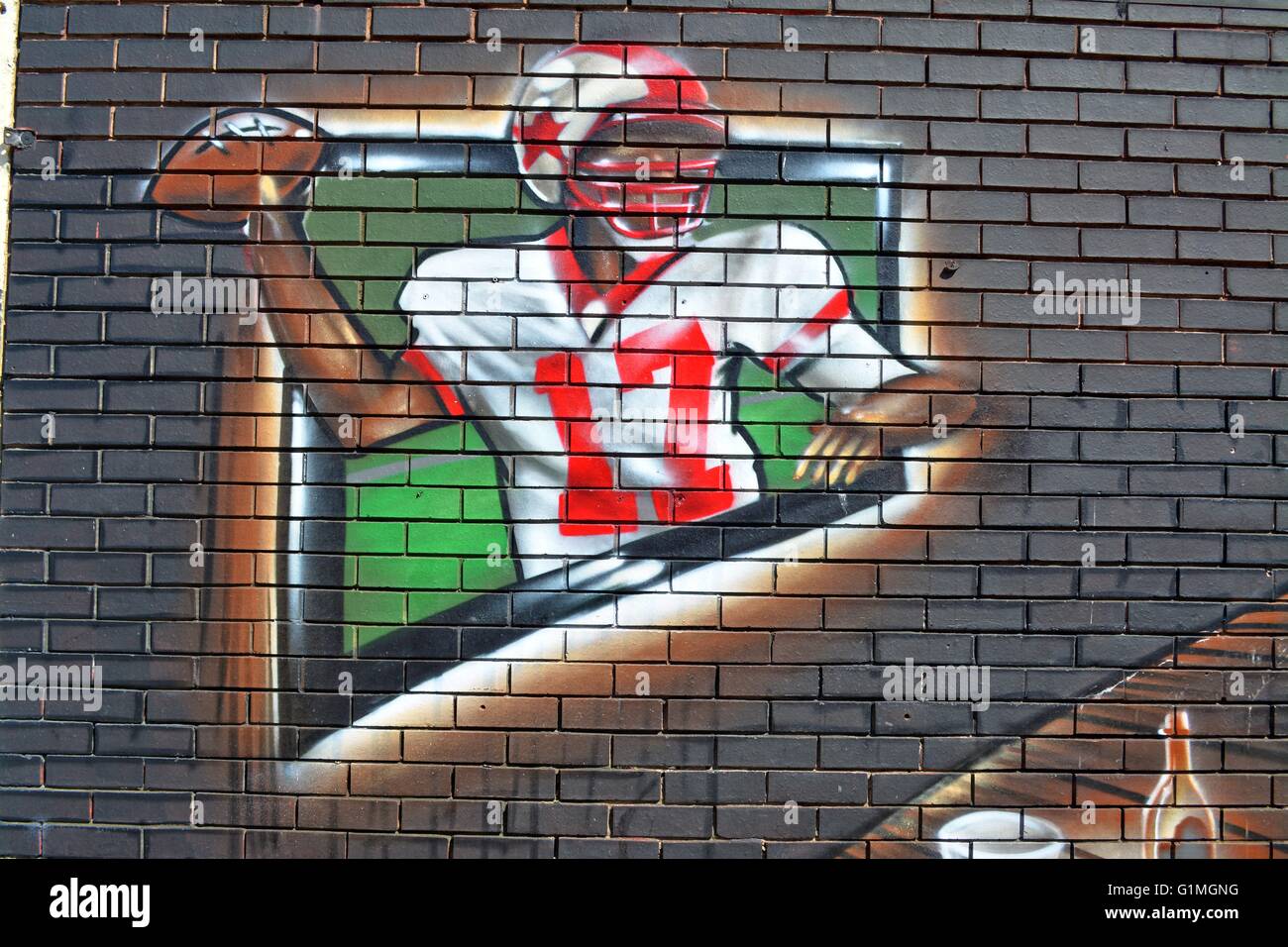 Graffiti in Wales, nationale Rugby-Spieler Graffiti an einer Hauswand Stockfoto