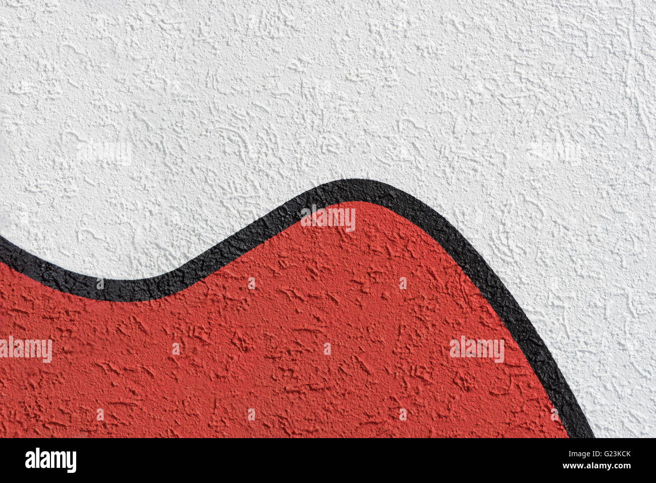 Weißer und roter Putz mit schwarzen Trennlinie Stockfoto
