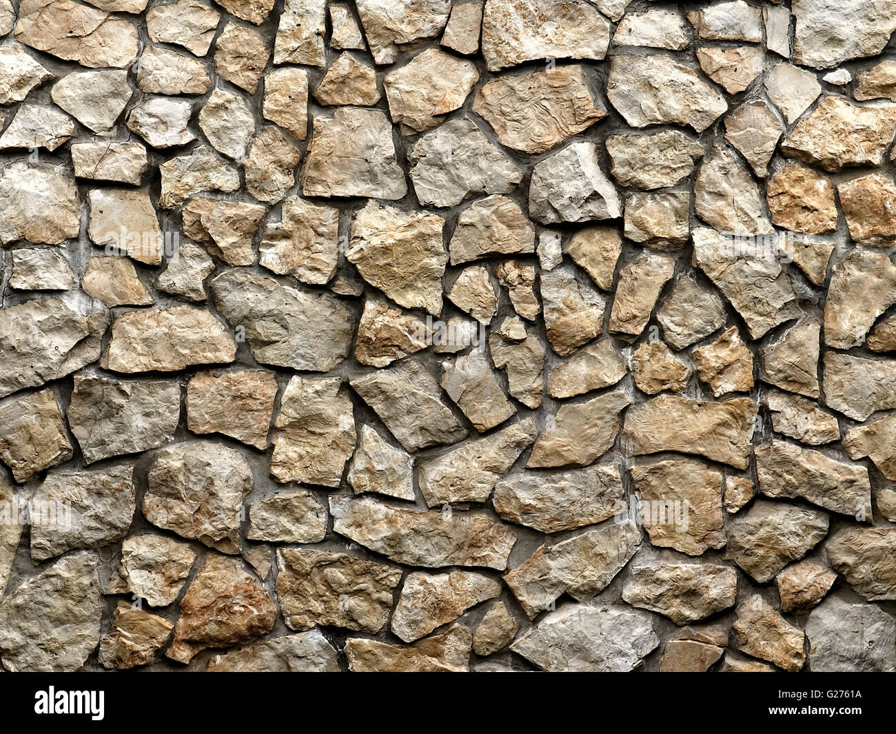 Grunge-Stadtmauer von groben Steinen als Hintergrund Stockfoto