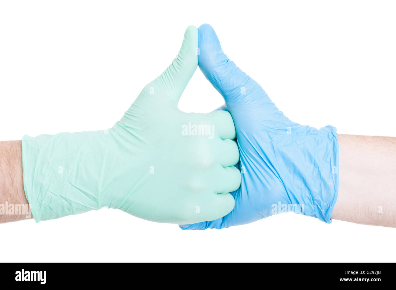 Ärzte Hand in Hand zusammen als Kollegen mit Latex- oder Handschuhen Stockfoto