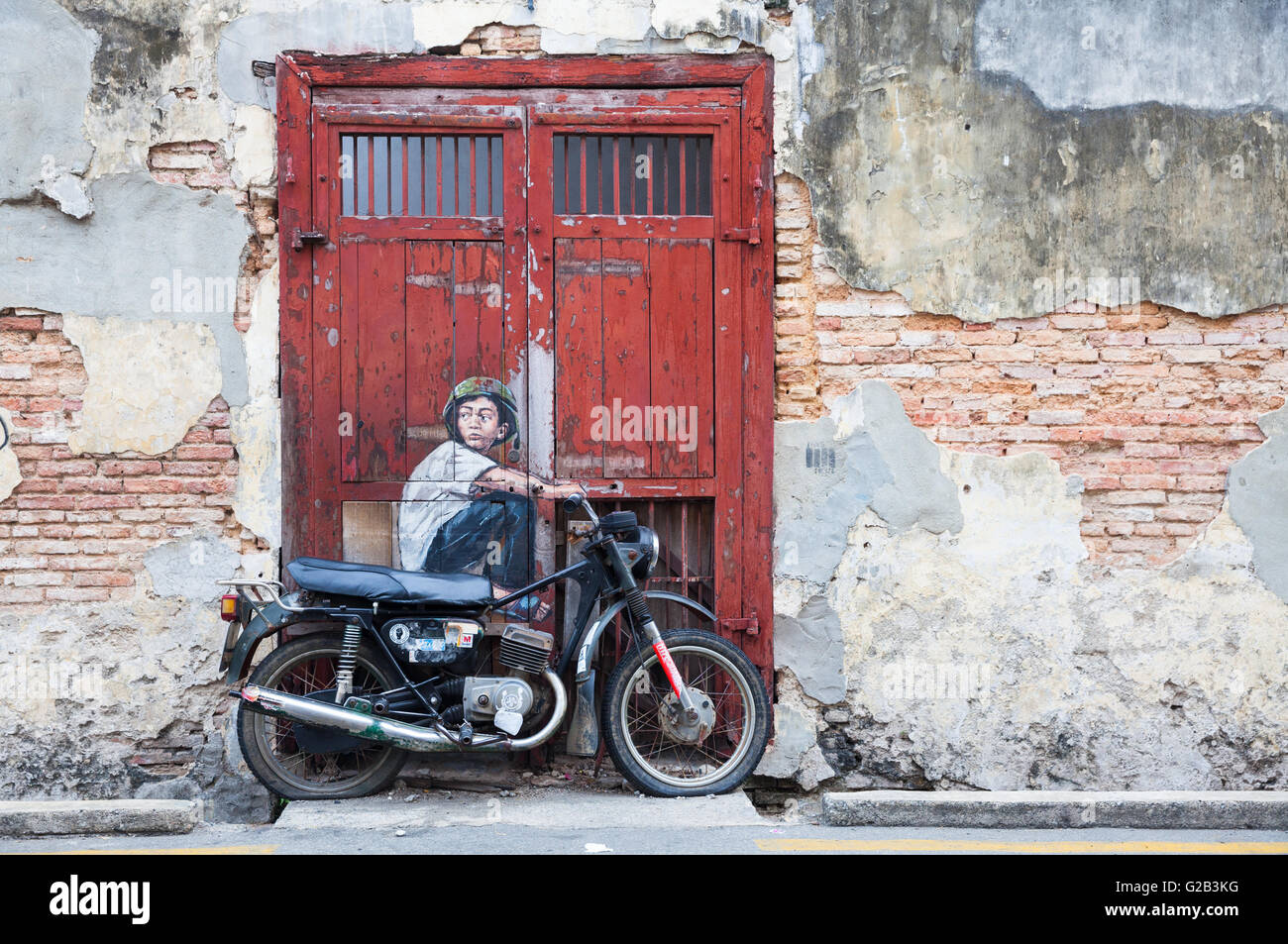 GEORGE TOWN, MALAYSIA - März 22: "Junge auf dem Motorrad" Straße Installation von Ernest Zacharevic auf 22. März 2016 in George Tow Stockfoto