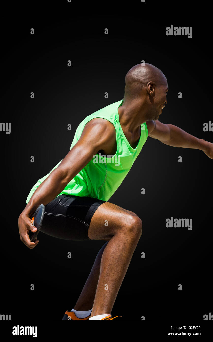 Male athlete throwing discus Fotos und Bildmaterial in hoher