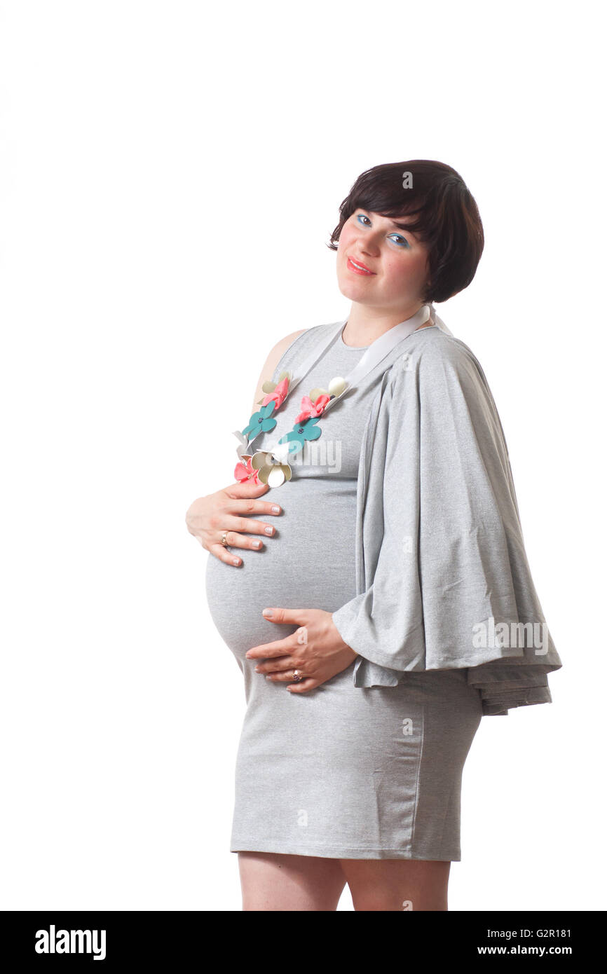 Junge Frau schwanger großen Bauch zu berühren. Stockfoto