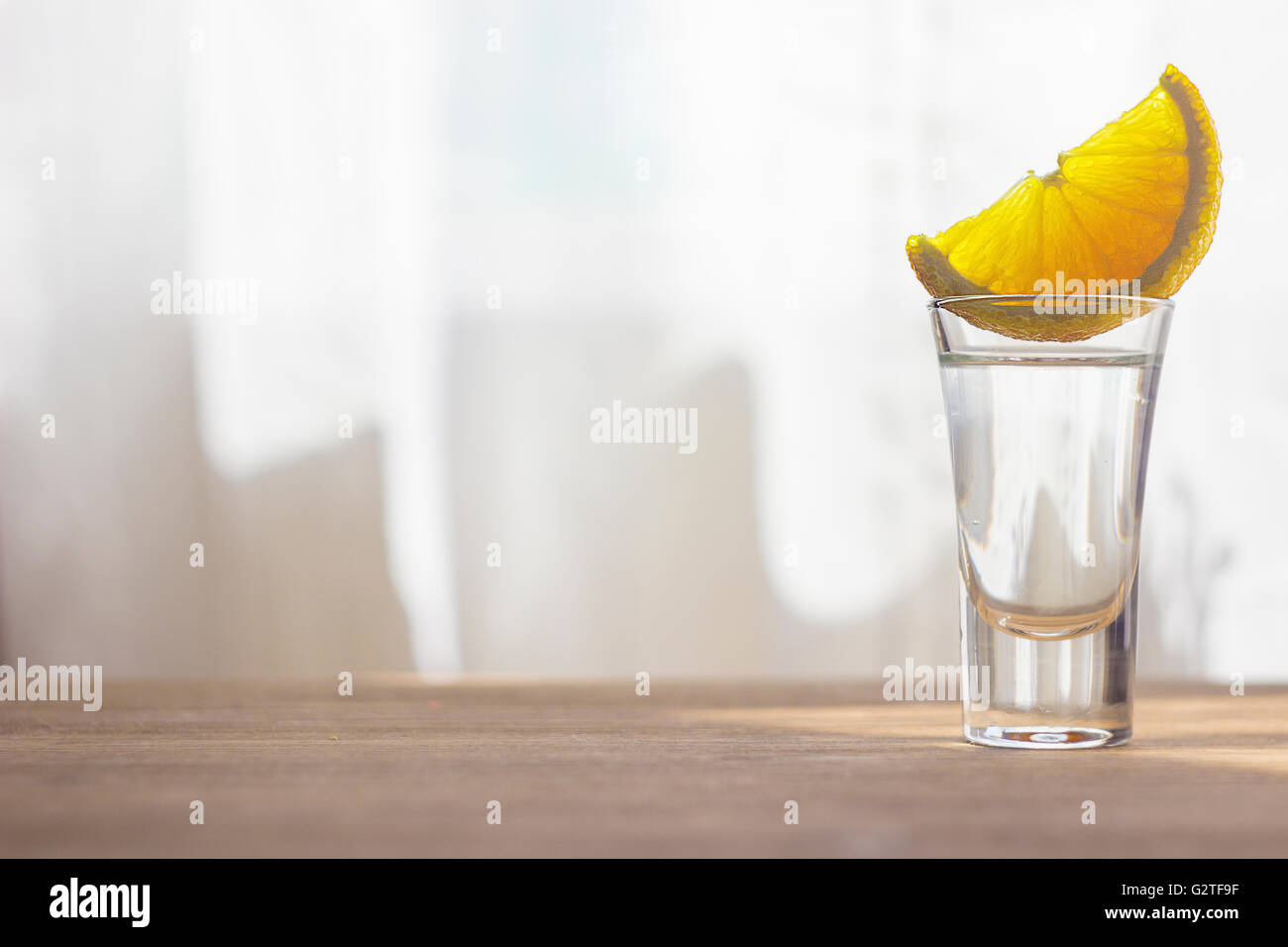 Tequila shot mit orange Stockfoto